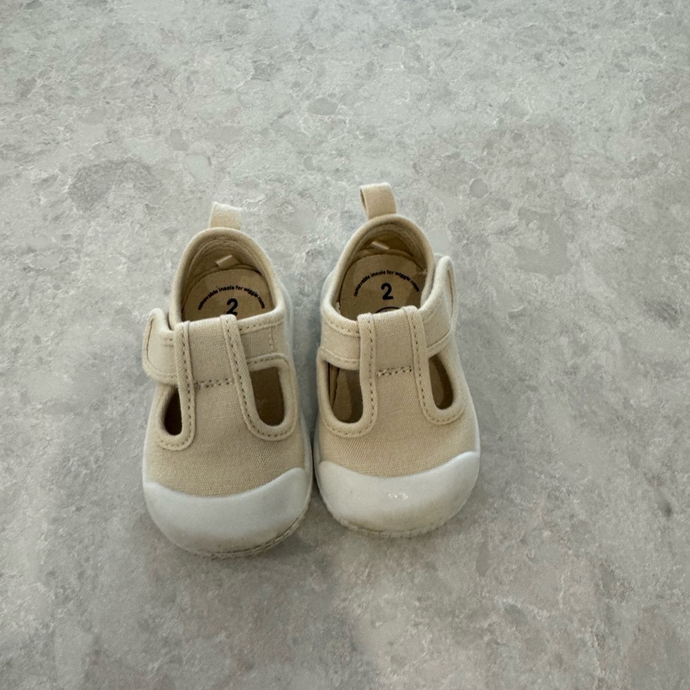 Baby cream/white Mary Jane’s. Velcro strap. Size 2. Wonder Nation.
